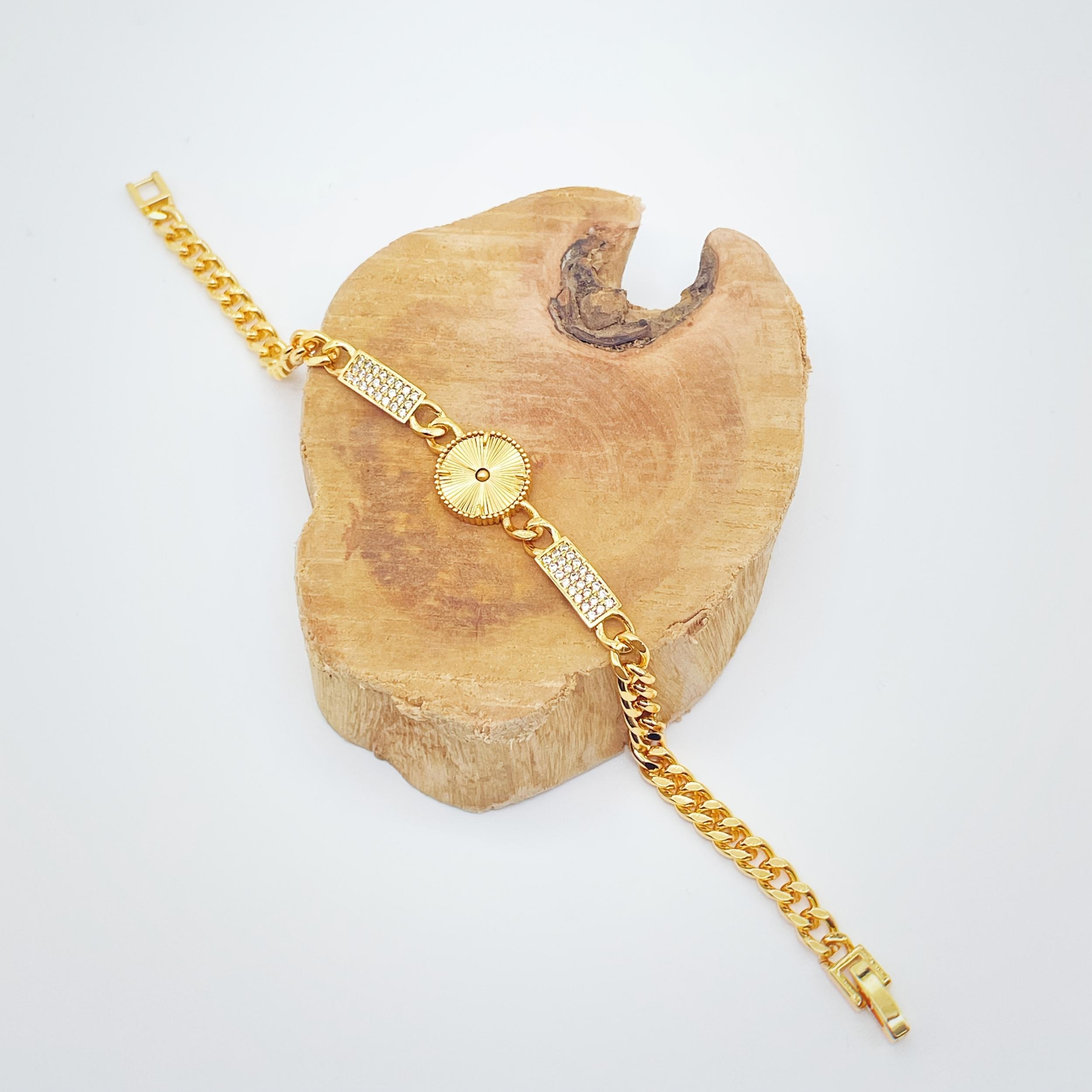 Golden Tone Bracelet with Sunburst Charm & Cubic Zirconia Accents